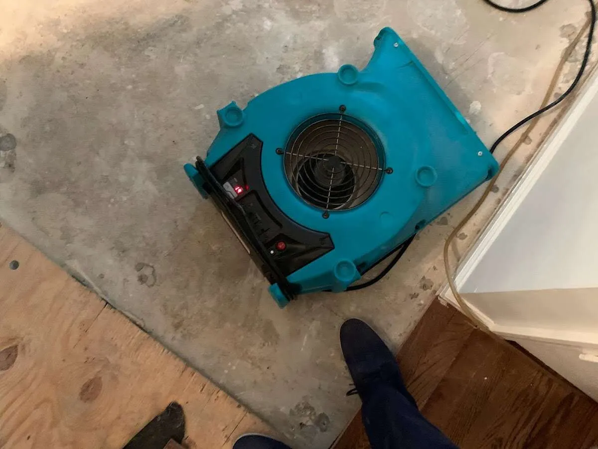 Air mover drying subfloor during Leak Detection & Repair in Cooper City